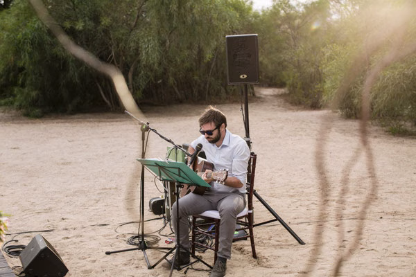 Live musician playing guitar at the wedding