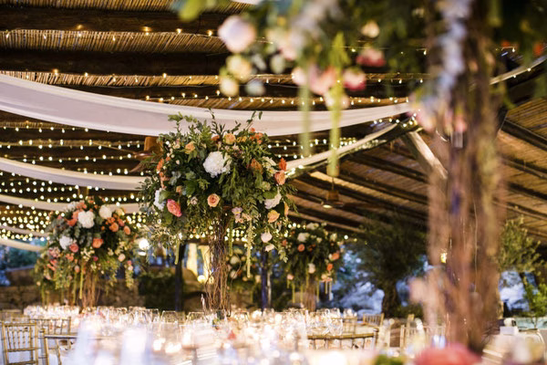 Decorated tables for an evening wedding reception